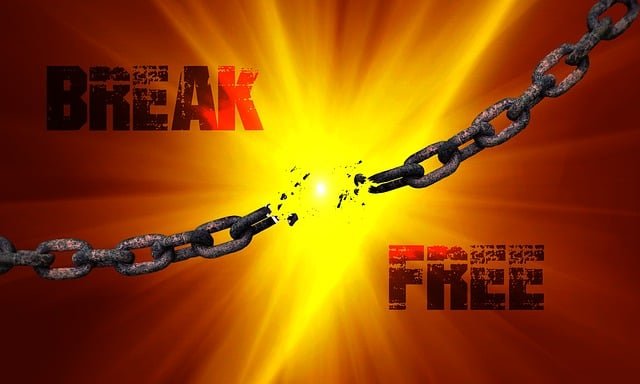 Chains breaking with light background and the words break free